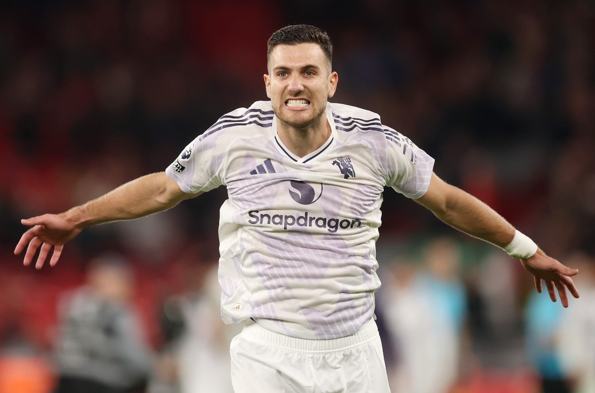 Diogo Dalot celebrates after Manchester United's win vs Liverpool