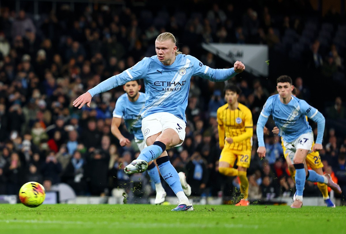 Erling Haaland scores a penalty for Manchester City against Brighton