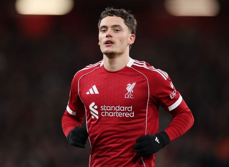 Florian Wirtz in the current Liverpool home kit in action at Anfield