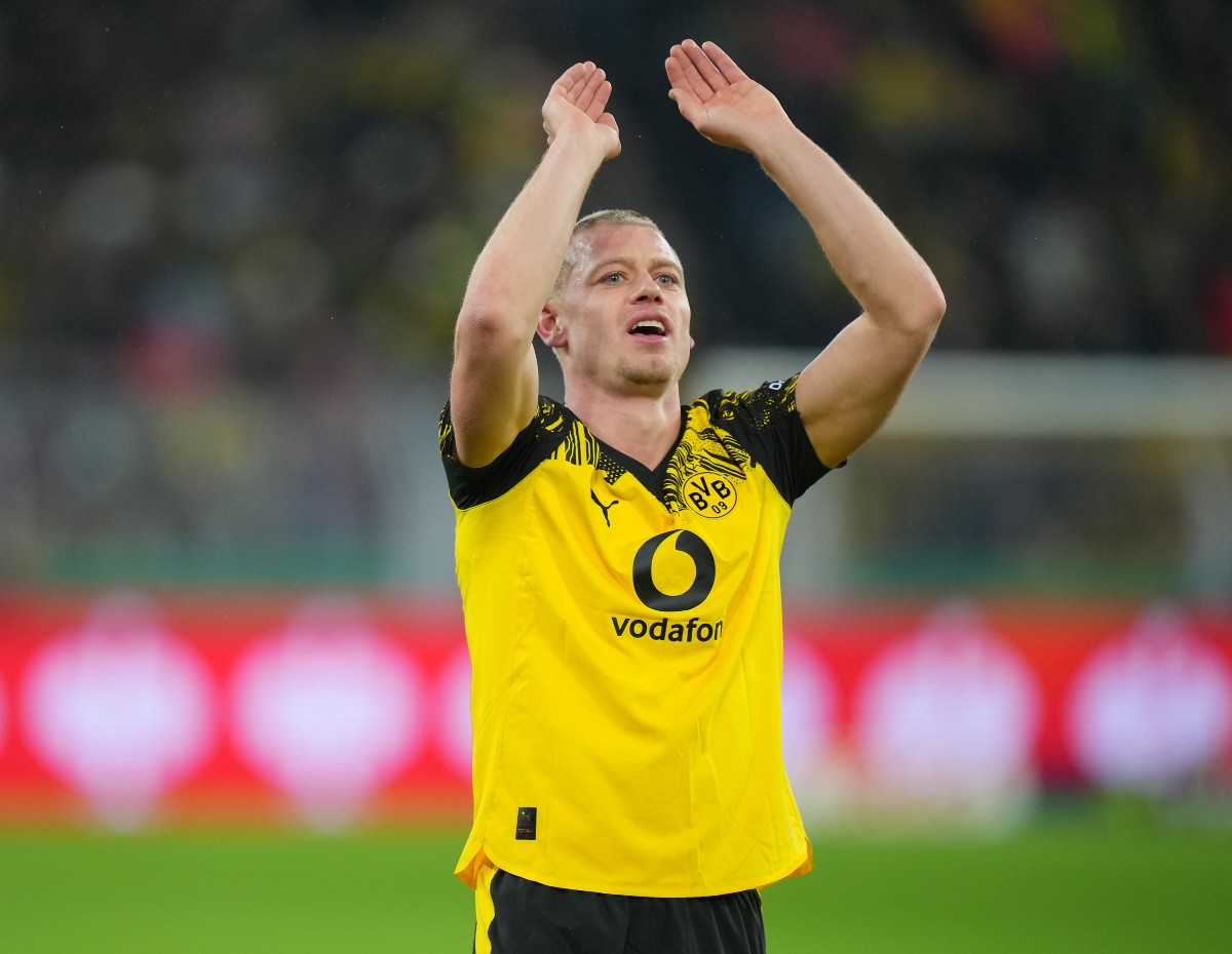 Julian Ryerson applauds the Borussia Dortmund fans