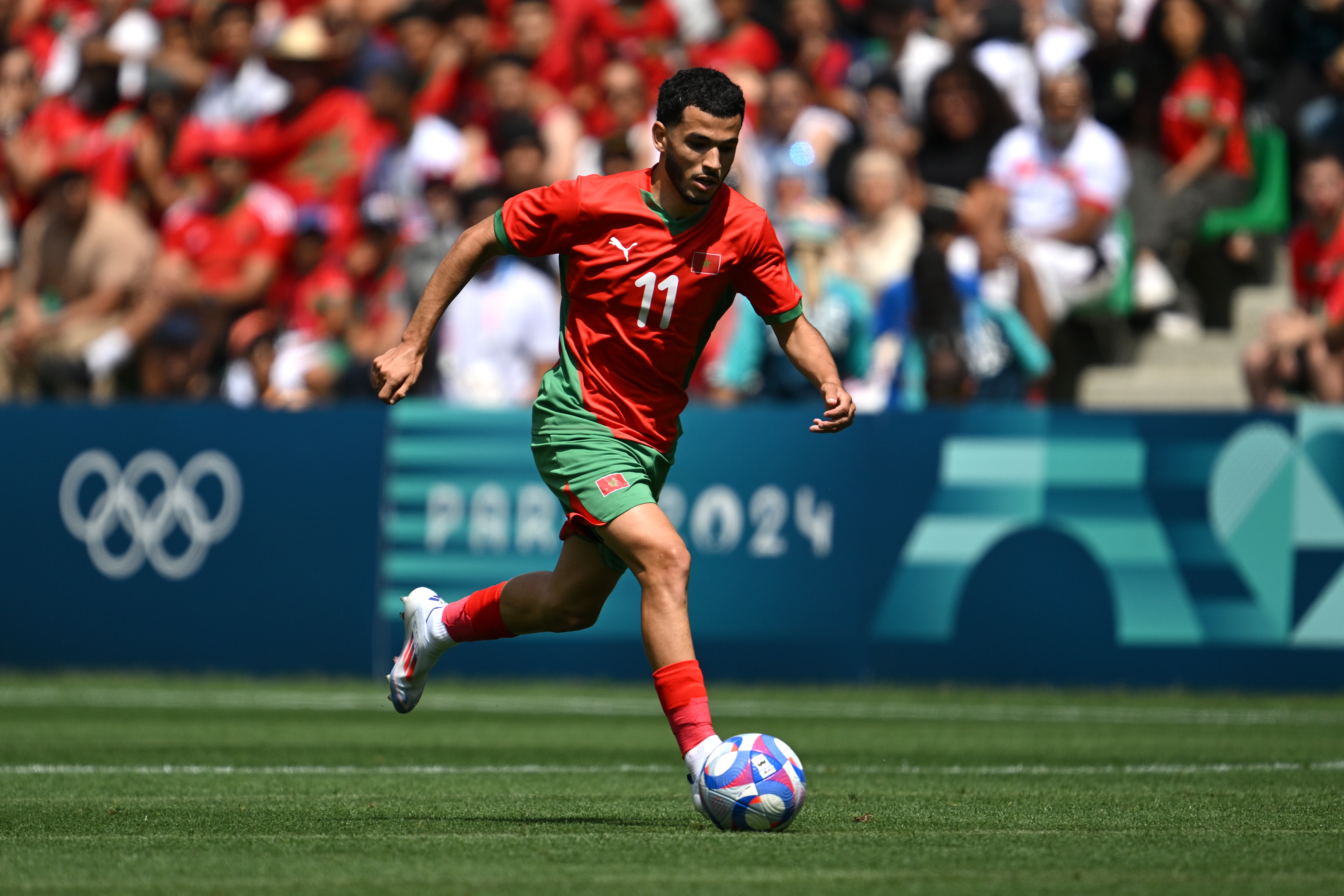 Zakaria el Ouahdi #11 of Team Morocco runs with the ball