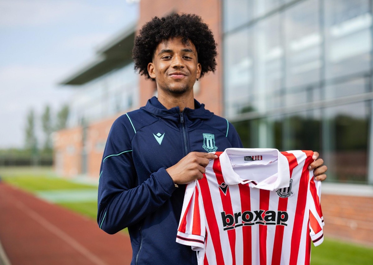 Jayden Dixon posing with a Stoke City shirt