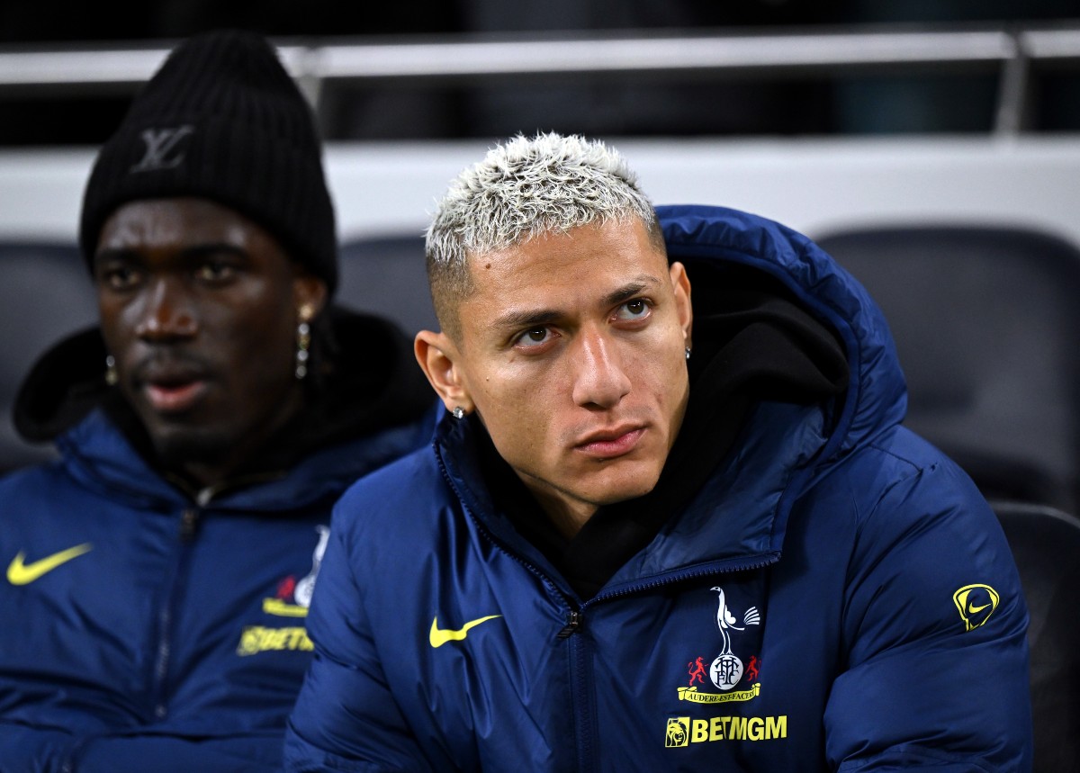 Richarlison looks on from the Tottenham bench