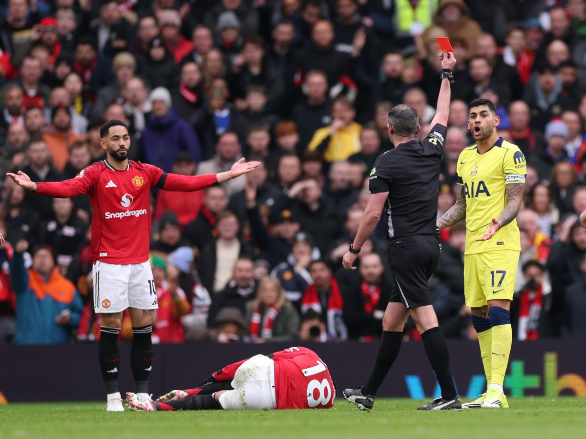 Tottenham's Cristian Romero is shown a red card against Manchester United