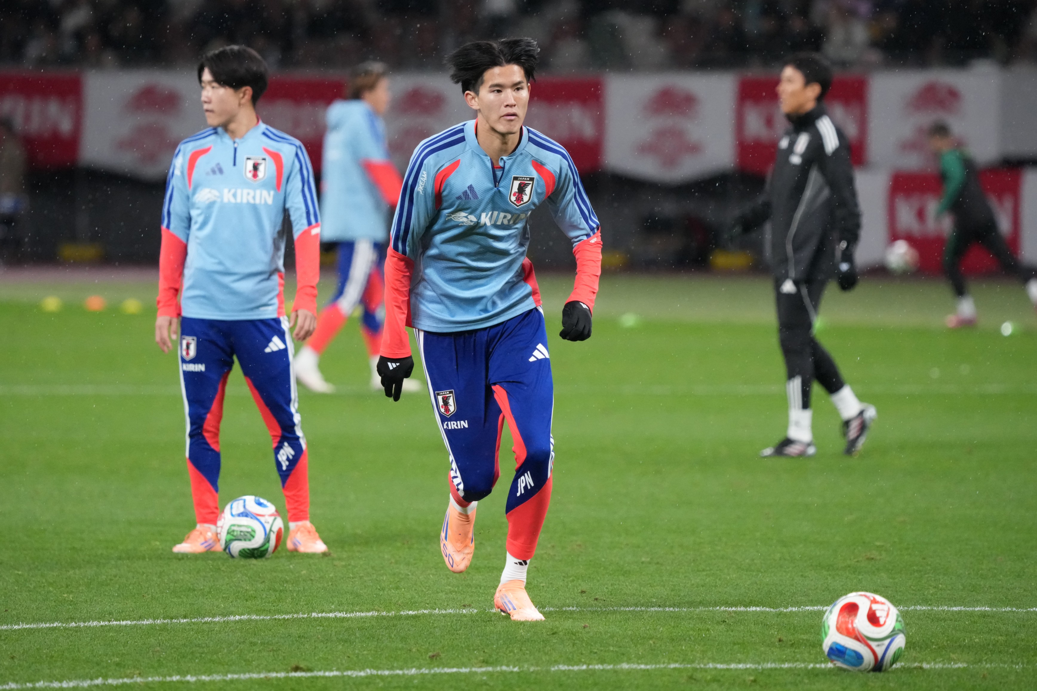 Keisuke Goto of Japan warms up ahead of the international friendly