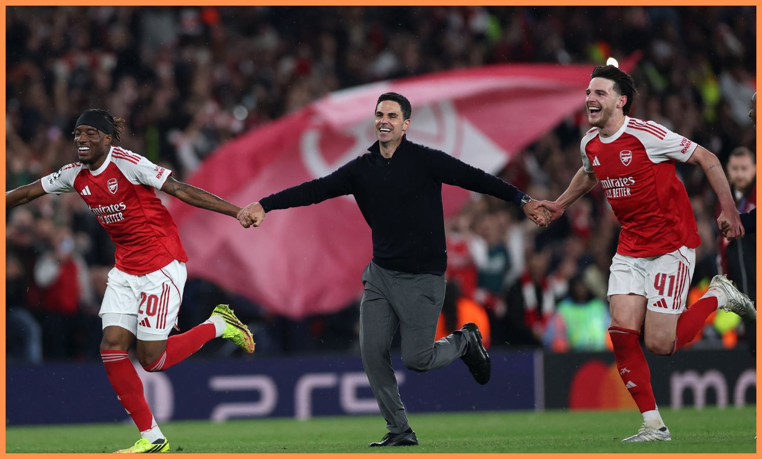 Mikel Arteta celebrating with Arsenal players after beating Atletico Madrid