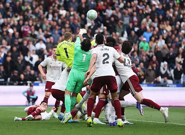 David Raya in a crowd allegedly being fouled