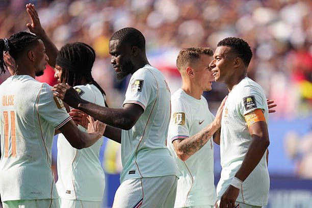 Mbappe and Dembele celebrating with France players