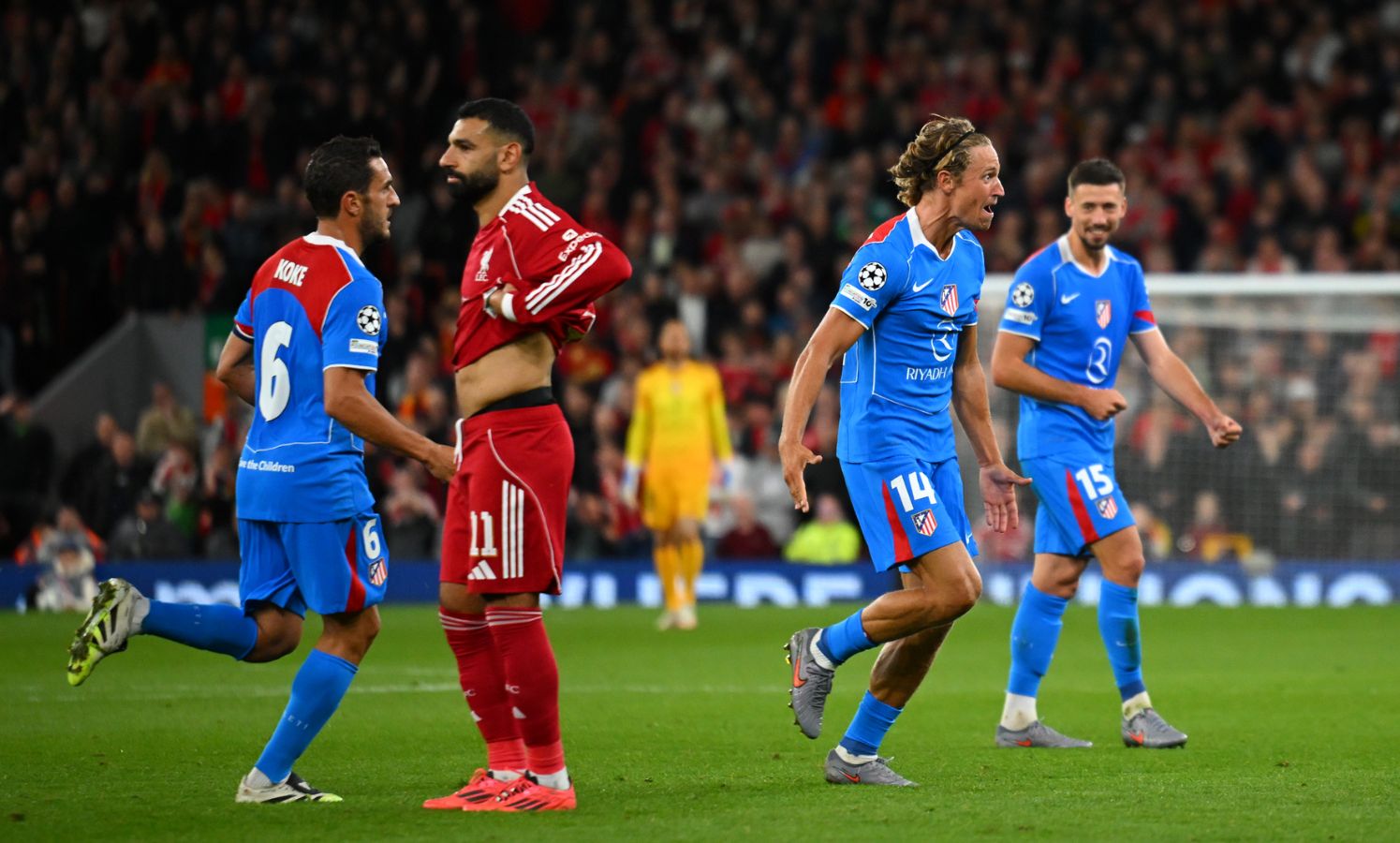 Marcos Llorente celebrates scoring his team's second goal with teammates during the UEFA Champions League 2025/26 League Phase MD1 match vs Liverpool at Anfield