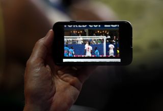 Fan at Wimbledon watching football